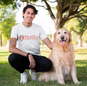 Person with dog in grassy area after mobile dog grooming